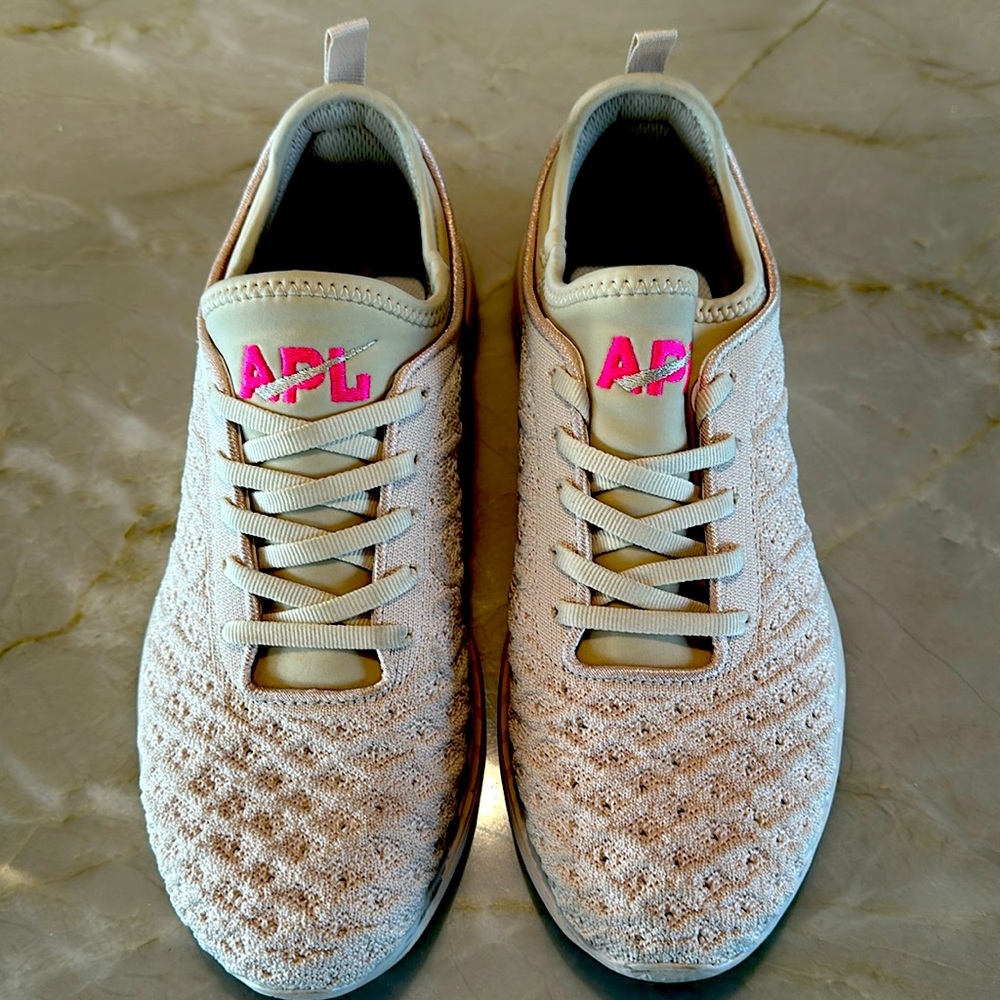 Barely worn womens APL size 8.5 in beige with pink APL accent
